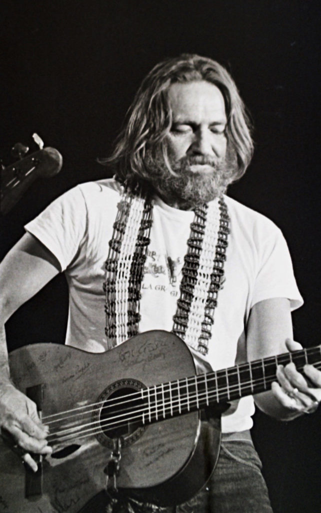 Willie Nelson has been putting on shows in Houston for a long, long time. Here, he performs at the Son of the Cosmic Cowboy concert at Hofheinz Pavillion in Houston, June 22, 1975. ©1975, 2020 — Photo by F. Carter Smith)