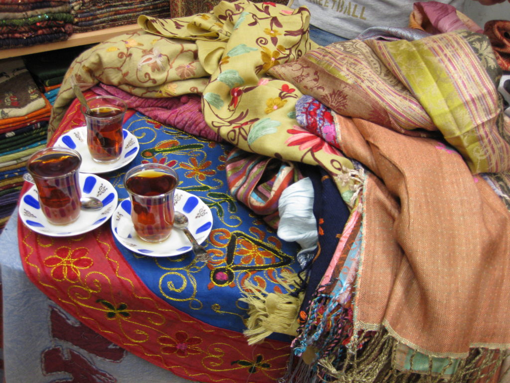 Mary Margaret Hansen's image of partaking of Turkish tea, served to scarf buyers, in Istanbul’s Grand Bazaar, a fave memory from the artist's 2009 trip.