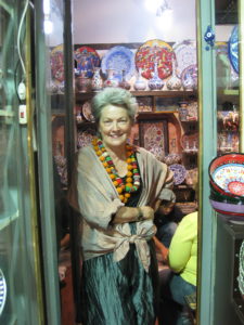 Artist Mary Margaret Hansen poses in the doorway of a shop in the Grand Bazaar, Istanbul, 2009.