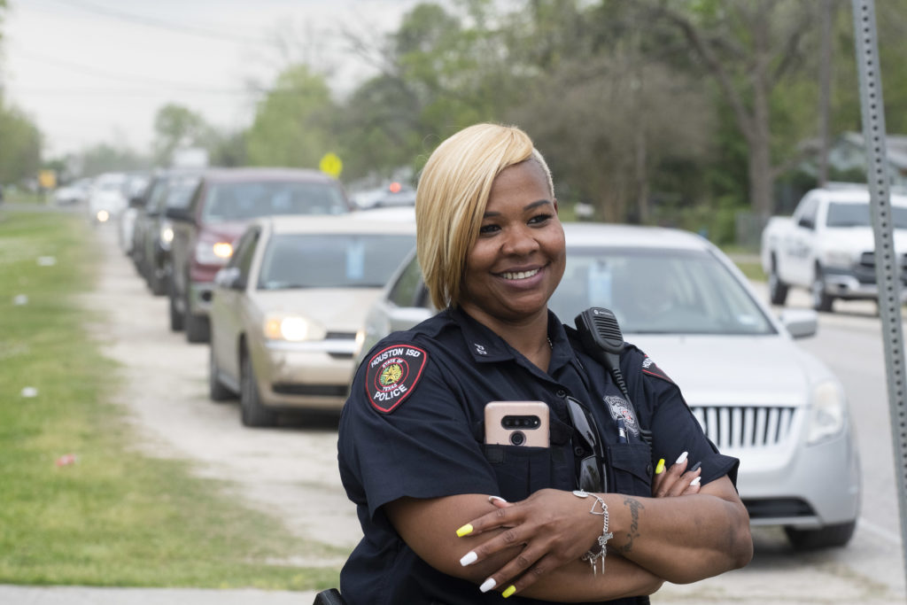 Houston police officers are still quick with a smile during the coronavirus pandemic. (Photo by F. Carter Smith)