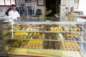 Sales are way off and supply orders curtailed at Bakery Donut, a Mom and Pop owned shop whose inventory of donuts remain unsold late Monday morning after the outbreak of Covid-19 (Photo by F. Carter Smith)