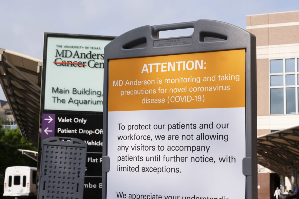 A sign at MD Anderson Cancer Hospital states that visitors will not be allowed to accompany patients in an effort to slow the spread of the coronavirus. (Photo by F. Carter Smith)