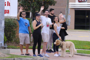 Houston friends enjoying the weekend by taking a walk and carrying beverages Sunday after the outbreak of Covid-19 (Photo by F. Carter Smith)