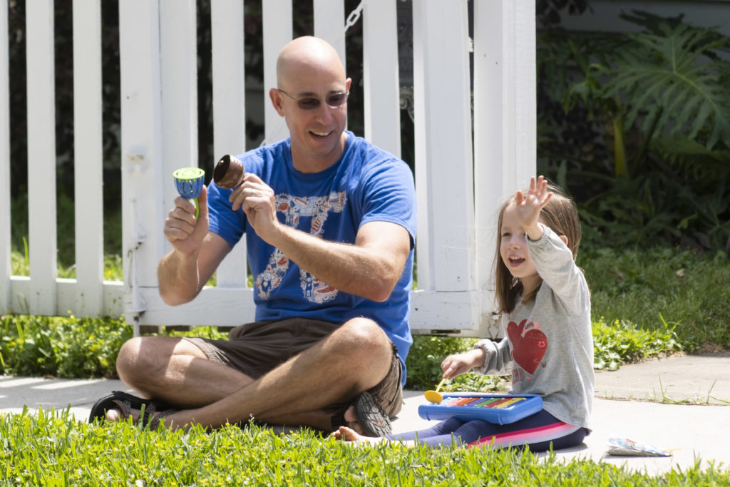 Teachers from Travis Elementary School paraded through their Heights neighborhood, and kids stuck at home came outside to cheer as they went by. (Photo by F. Carter Smith)