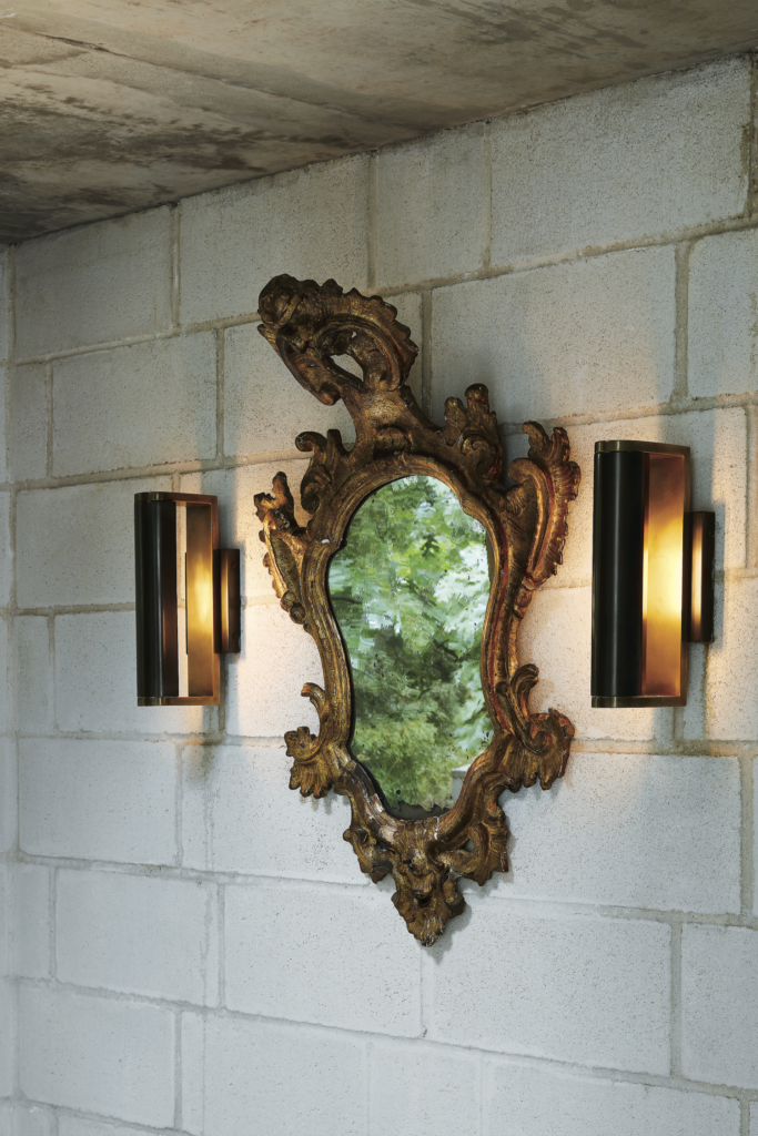 David Griffin and James Ferrara, published July/August 2017. Architectural design James Ferrara. Interior design Jennifer Haralson. Photographed by Lisa Petrole. David Griffin and James Ferrara’s modernist villa in Oak Cliff’s Kessler Woods was inspired by Italy and 16th-century architecture. In the vestibule, late-18th-century Venetian mirror from James Powell Antiques, Austin.
