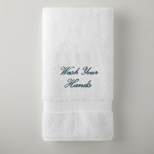Grange bath towel embroidrerd with “Wash Your Hands” is $25. All proceeds to to funding Peacock Alley’s mask-making efforts.