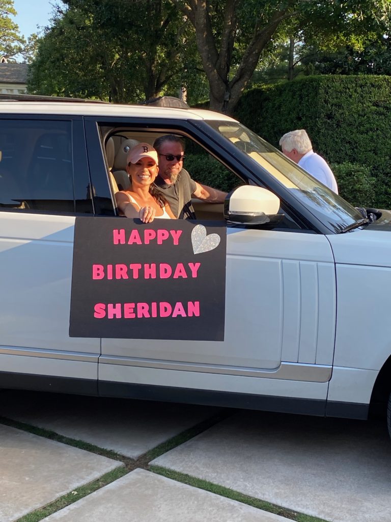 Rachel and Jeff Bagwell pause for a brief visit during Sheridan William's drive-by birthday celebration.