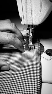 A Levenity mask in progress, made from heavyweight cotton gingham fabric.