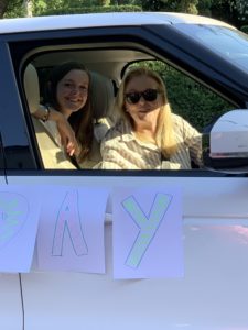 Juliette Sweeney and Laura Sweeney sending birthday best wishes through the car window.