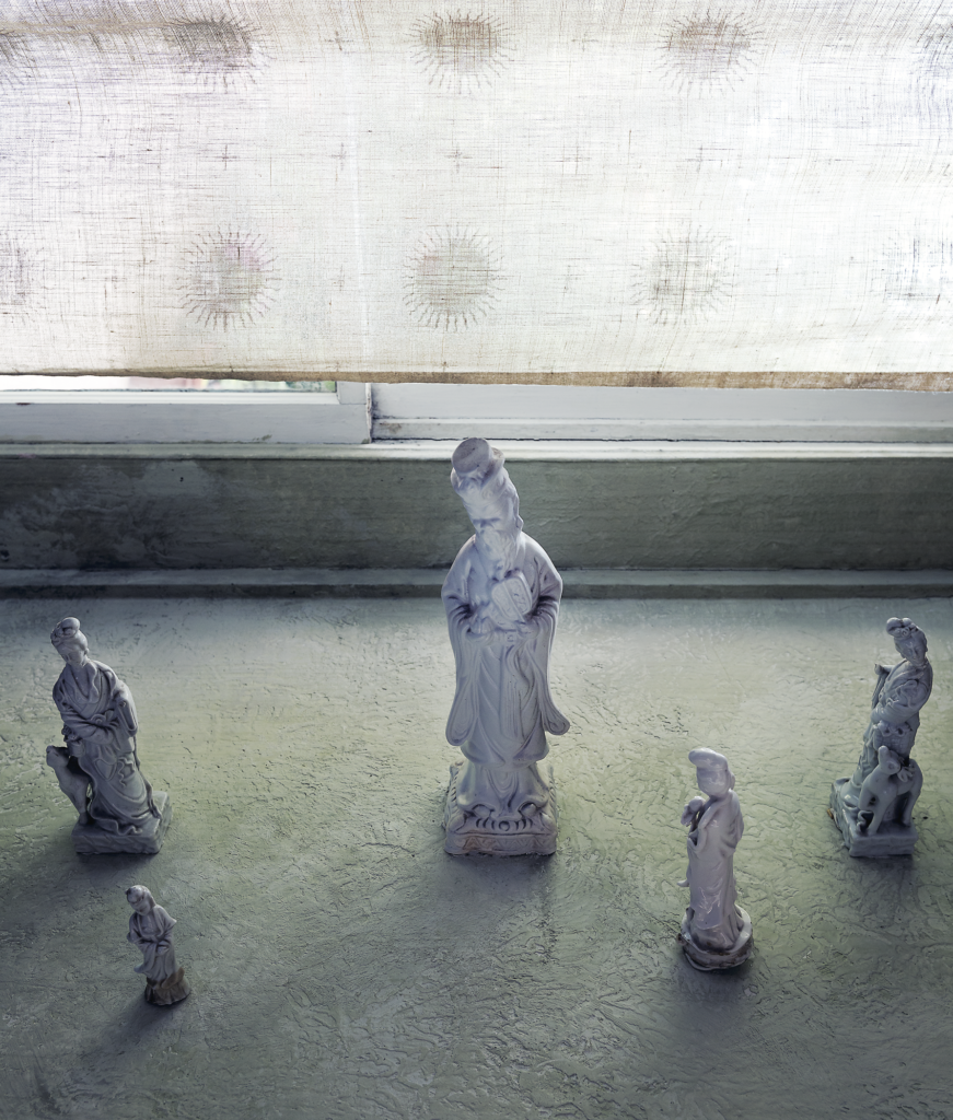 Rusty Arena, published October 2013. Photographed by Jack Thompson. In artist Rusty Arena’s 1910 historic Montrose home, a vignette on a windowsill. 

