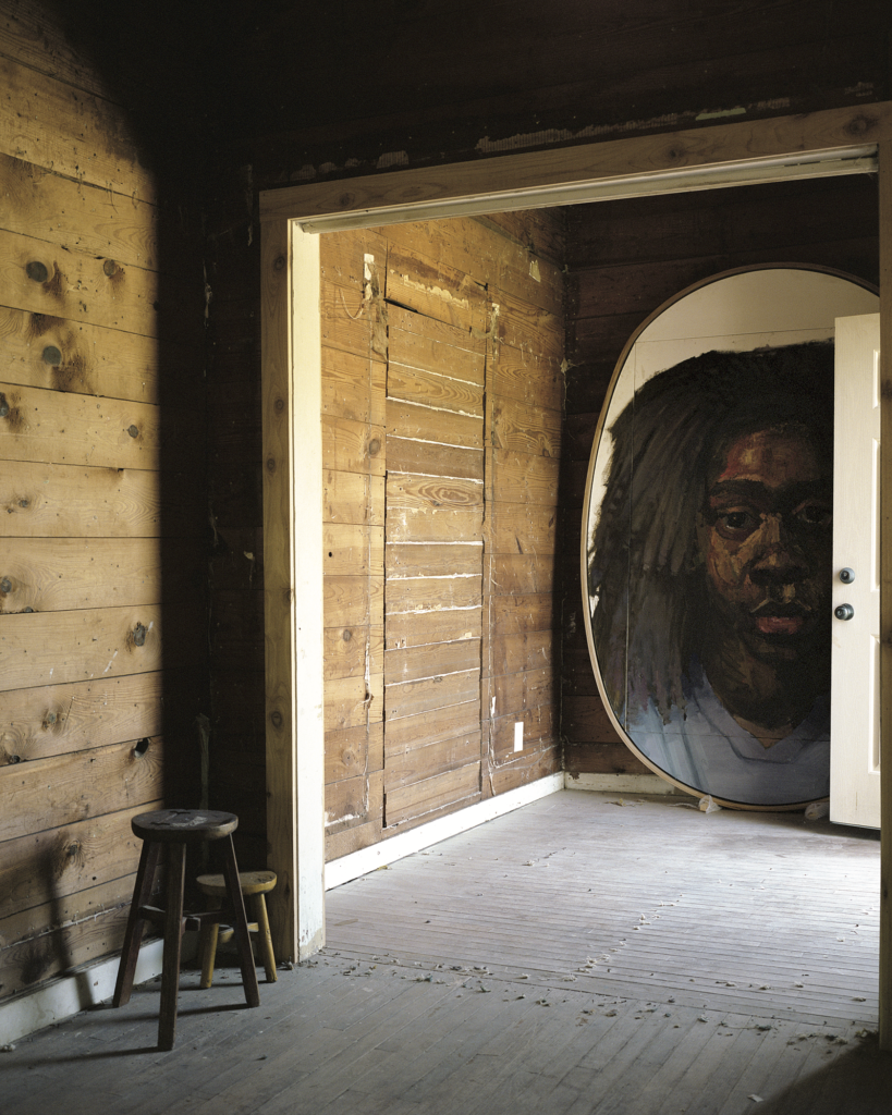 Artist Sedrick Huckaby, published October 2016. Photographed by Max Burkhalter. In artist Sedrick Huckaby’s grandmother’s humble Fort Worth home,  which he has purchased and is restoring, is his portrait of daughter Halle Lujah.