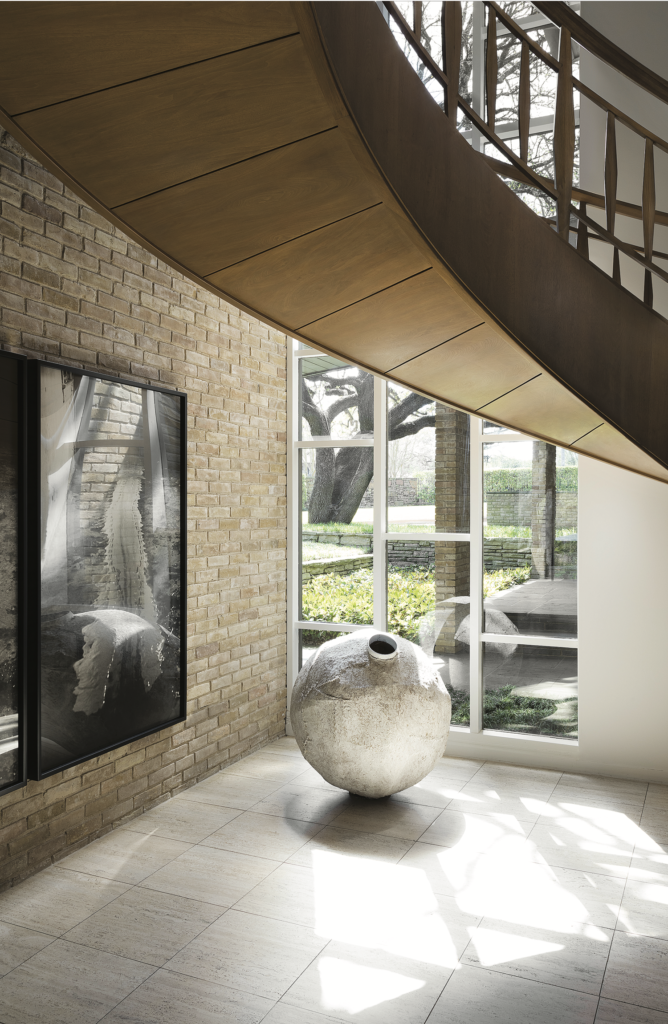 Sharon and Michael Young, published March 2017. Interior Design and Architectural Renovation Bodrun + Fruit. Photographed by Lisa Petrole. In art collectors Sharon and Michael Young’s 1961-era home in Dallas’s Preston Hollow, the magnolia-wood floating staircase is original to the house. Miroslaw Balka’s "Untitled," 2001. Hanging, Paul McCarthy’s "White Line Painted on the Floor with my Face," 1972. 