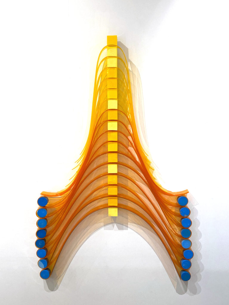 Eva LeWitt's "Yellow Loops, Blue Dots," 2020, transforms prosaic plastic material (here, PVC plastic, polyurethane foam, and Lexan) into surprising objects with a fetishistic sensibility. If the last name is familiar, it's because she's the progeny of minimalist/conceptual master Sol LeWitt. (Courtesy the artist) 