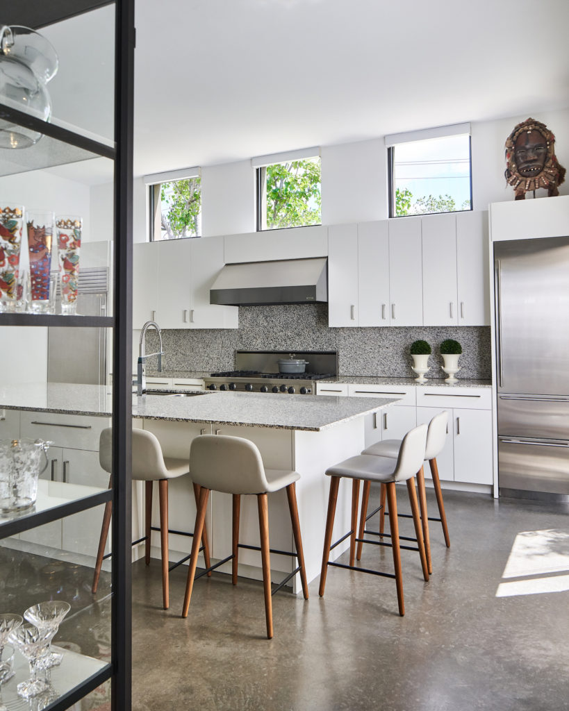 Granite was a cutting-edge material 20 years ago, and although it’s now considered dated, the homeowner has no plans to replace it. “I wanted to embrace the house just the way it is.” (Photo by Stephen Karlisch)