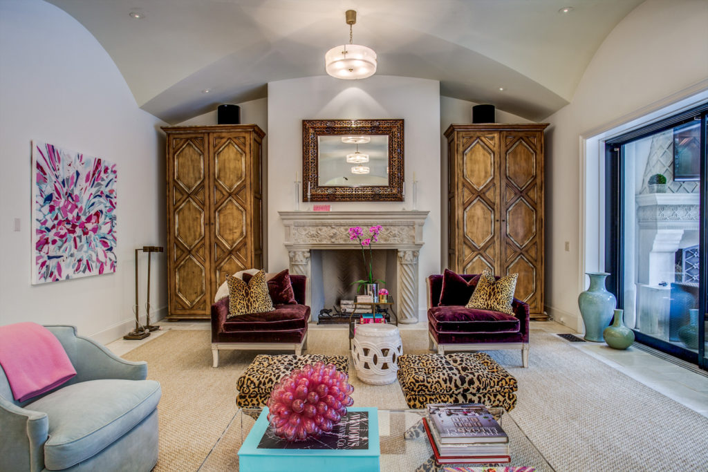 An inviting family room features a full retractable wall of windows. (Photo by Compass Real Estate)
