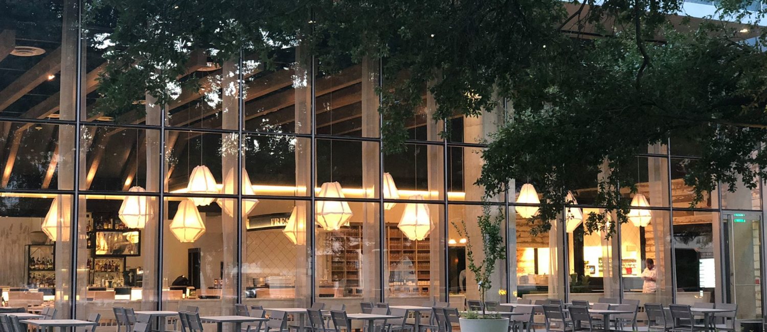 Al fresco dining at Eunice is a beautiful experience beneath the venerable oak trees that shade the patio.