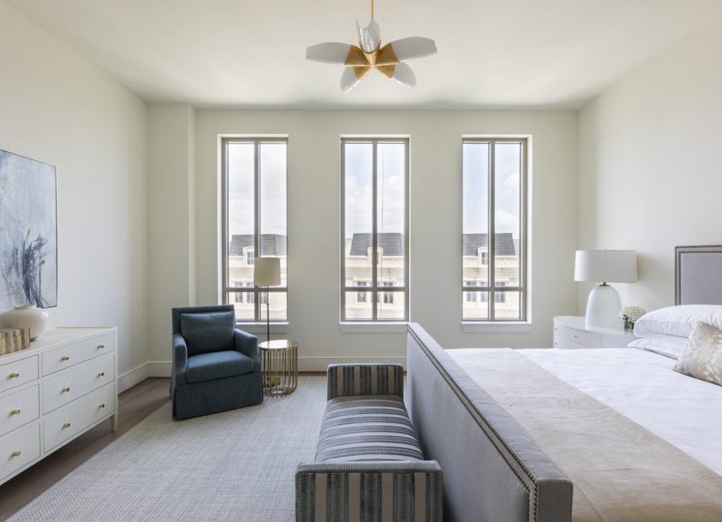 Three stately windows are a focal point of the master bedroom. (Photo by Julie Soefer)