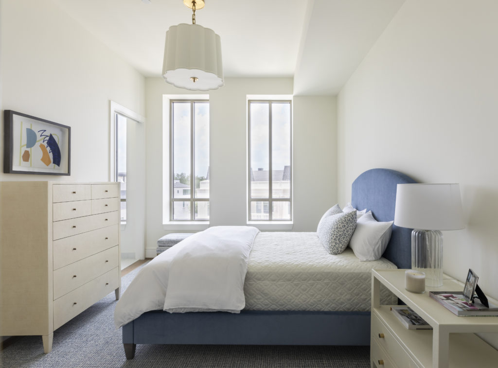 The second bedroom with ample light and high ceilings. (Photo by Julie Soefer)