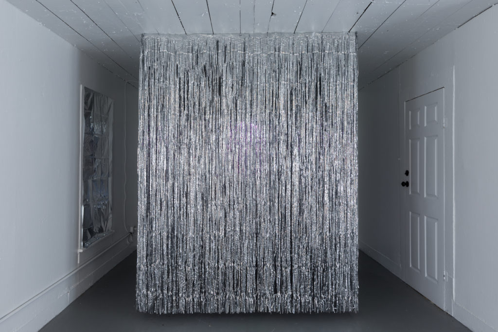 A tinsel curtain evokes a performance stage in "Sugar Water," by Jasmine Zelaya at Project Row Houses, summer 2020. (Photo by Alex Barber)