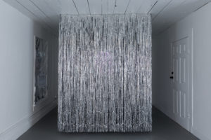 A tinsel curtain evokes a performance stage in “Sugar Water,” by Jasmine Zelaya at Project Row Houses, summer 2020. (Photo by Alex Barber)