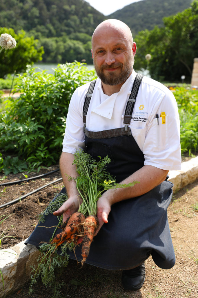 Executive chef Stephane Beaucamp in the robust vegetable garden that provides food for the resort.  (Photo by Gary Bogdon)