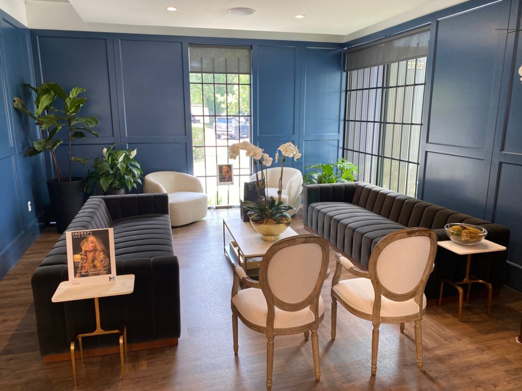 The sleek lounge at the new Therapy Hair Studio will remain empty as long as coronavirus protocols remain in place. (Photo by Shelby Hodge)