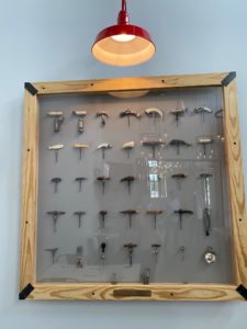 The Craig and Mary Jo Beyer cork collection adorns a wall in one of the two private dining rooms. (Photo by Shelby Hodge)