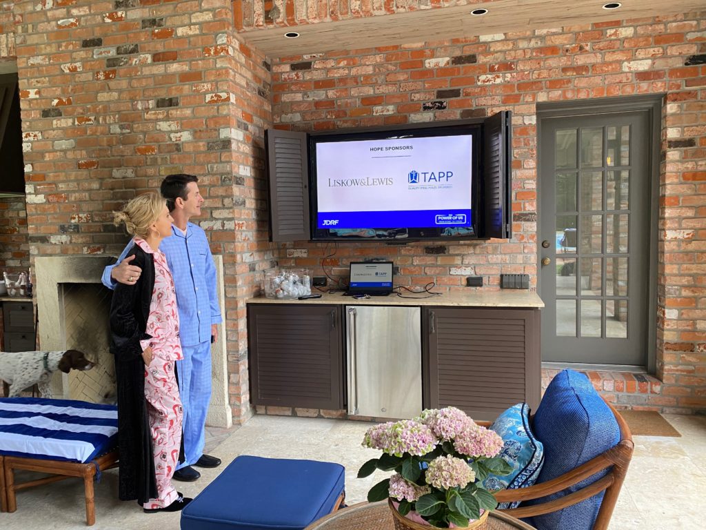 Amber & Clay Bretches tune into the JDRF Houston virtual gala, viewing it in their family room. (Photo by Barbara Perlick)