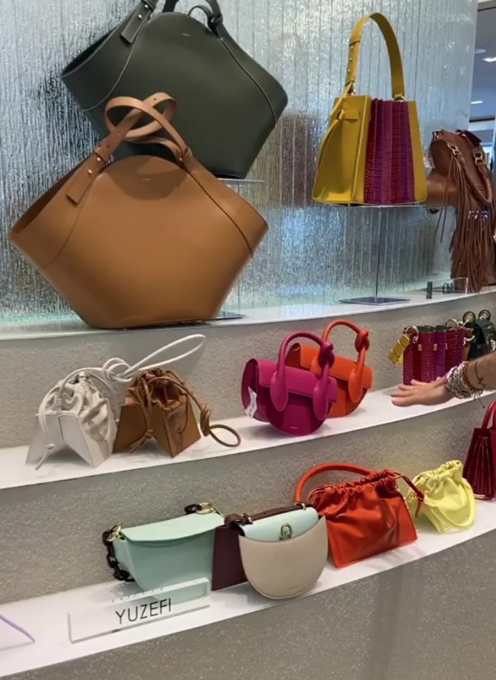 Designer handbags on display at Tootsies.