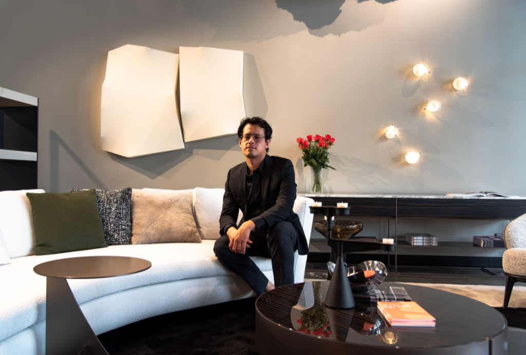 Houston-based Eduardo Portillo with his sculptural painting, "Sonora DS32," 2019, at CAM Studio in the exhibition "The Magnificent Seven," curated by gallerist Barbara Davis, who represents all the artists in this pop-up exhibition that fosters a dialogue between art and design. (Photo by Krzysztof Kwiatkowski) 