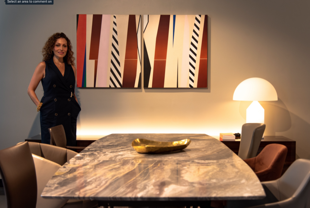 CAM Studio's Carla Muñoz with California artist Mel Davis' canvas "Untitled," 2019. The West Coast painter is being presented by CAM Studio in "The Magnificent Seven," curated by noted Houston gallerist Barbara Davis. (Photo by Krzysztof Kwiatkowski)
