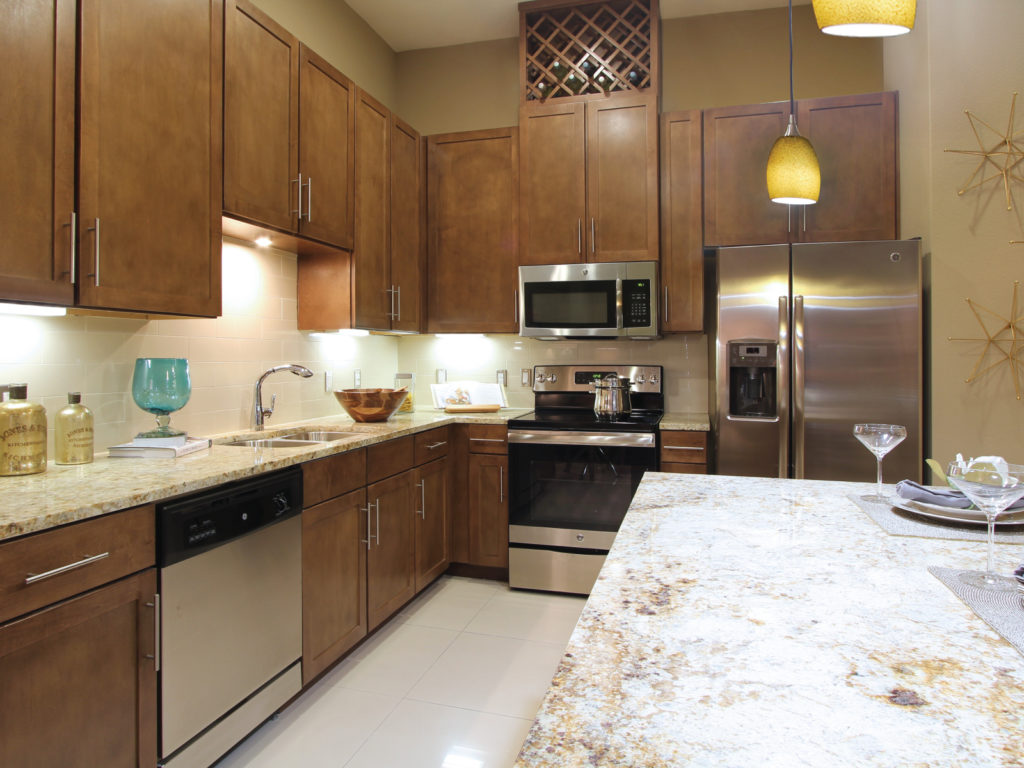Kitchens feature granite counter tops, stainless steel appliances and custom cabinetry.