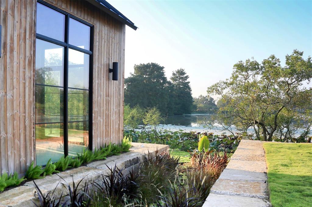 A compelling view of the lake from the house in the Orchards at Pecan Acres. (Photo by ProHouston)