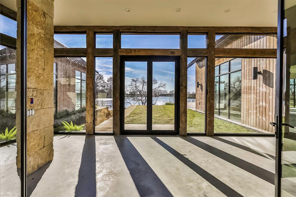 Wide expanses of glass reveal views to Lake Lucille and pecan orchards. (Photo by ProHouse)