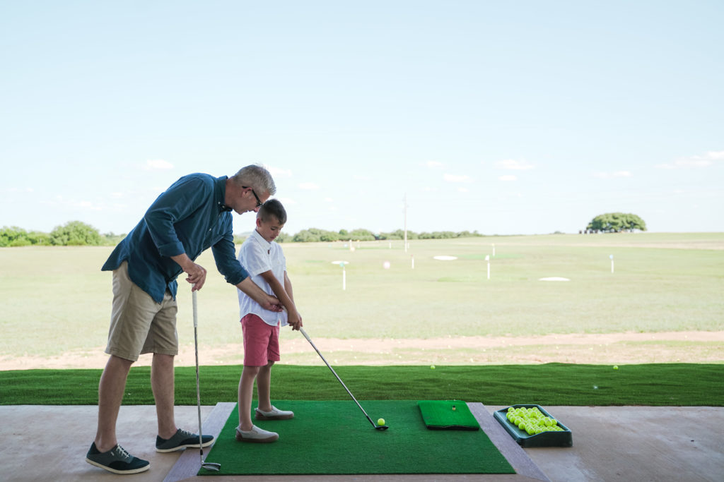 Tee up at the driving range.