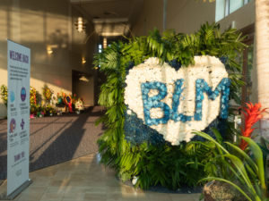 Houston Police officers salute the casket and family of George Floyd as they arrived for his funeral at the Fountain of Praise church