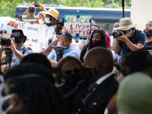 Houston Police officers salute the casket and family of George Floyd as they arrived for his funeral at the Fountain of Praise church