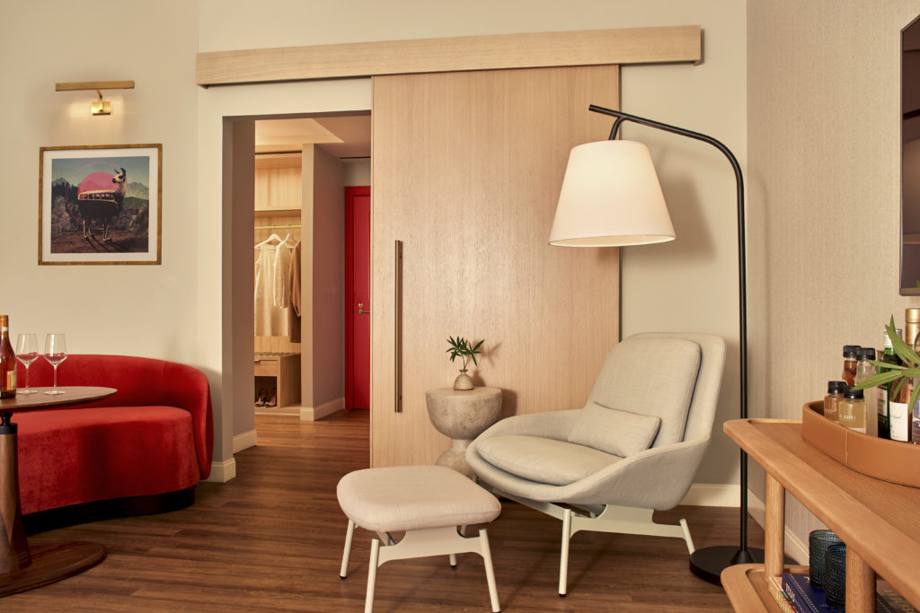In the Grand Chamber suite, splashes of red liven Swoon's calm palette of mid-century inspired furnishings and natural materials like oak, leather, and concrete.  