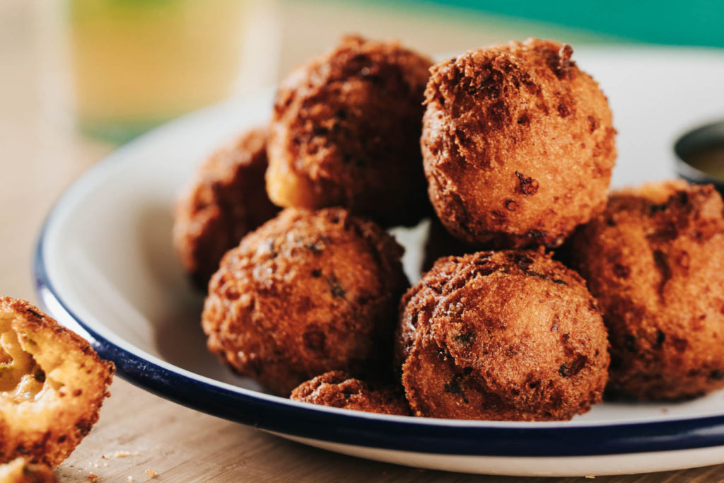 The hush puppies at JAXON come with jalapeno and cheddar cheese.