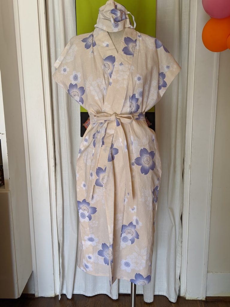 Kimono Zulu reimagined ivory-and-lavender floral vintage sleeveless yukata with matching mask and belt
