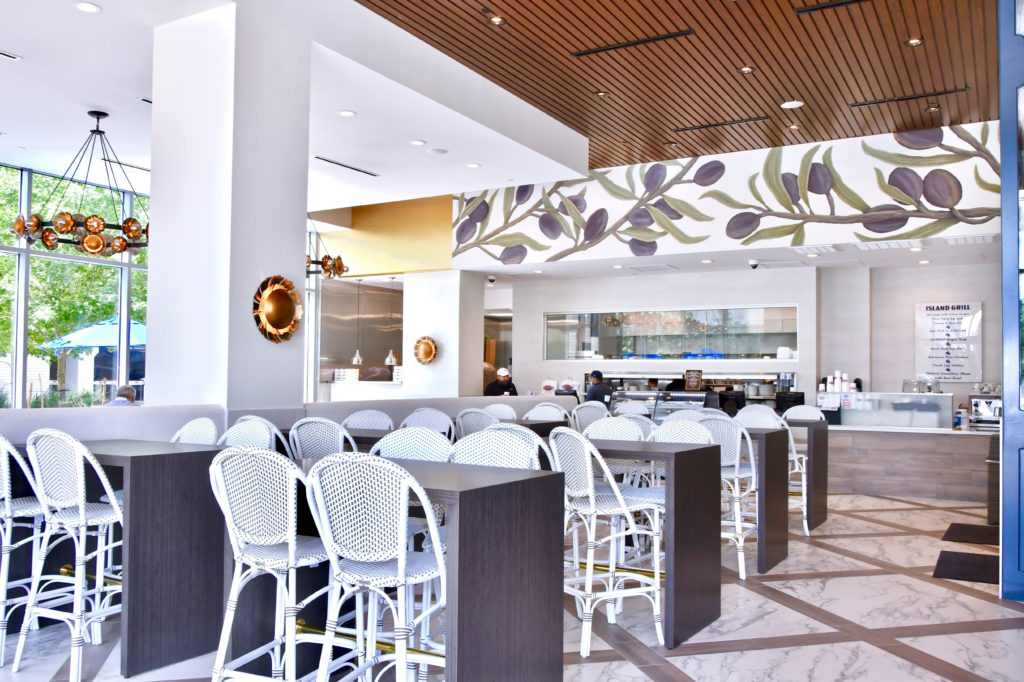 The relaxing interior of the Springwood's dining room, with painted olive branches. 