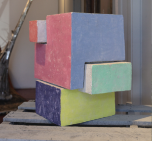 Houston sculpture duo Sean Michael Kirby and Patrick Renner collaborate on “architecture as painting,” 2020, crafted from intriguing materials — reanimated paint burnished into concrete over carved polystyrene. (Courtesy the artists)