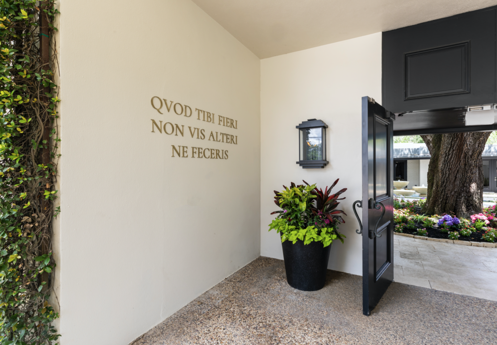At the entrance, a Latin phrase (the translation of "The Golden Rule") puts forth Sydenham Clinic's timeless mantra. (Photo by Julie Soefer)
