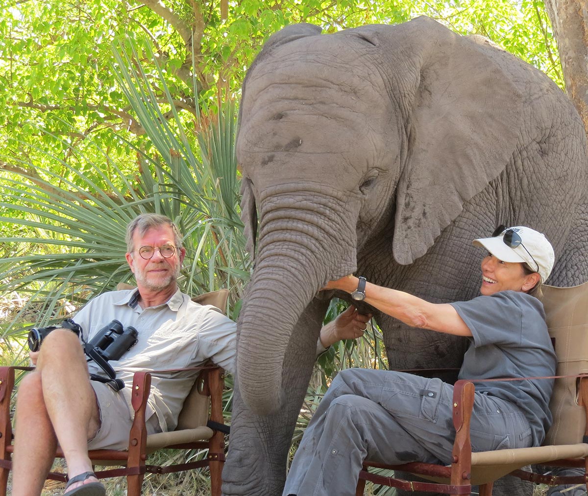 Scott Jackson, Naledi, and Debra Stevens at Elephant Havens. Naledi is 7-years old in this picture, sucking on Stevens’ fingers like a pacifier.