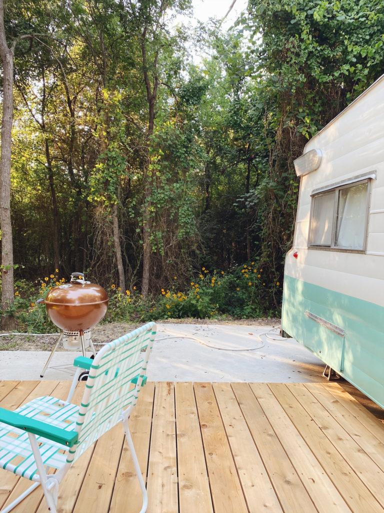 Every vintage trailer rental comes with its own deck and Weber charcoal grill.