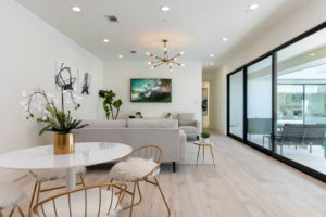 11 Inwood – Lounge and dining with view to the central pool