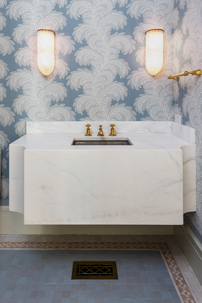 The bathrooms are filled with designer wallpaper. (Photo by Stephen Reed)