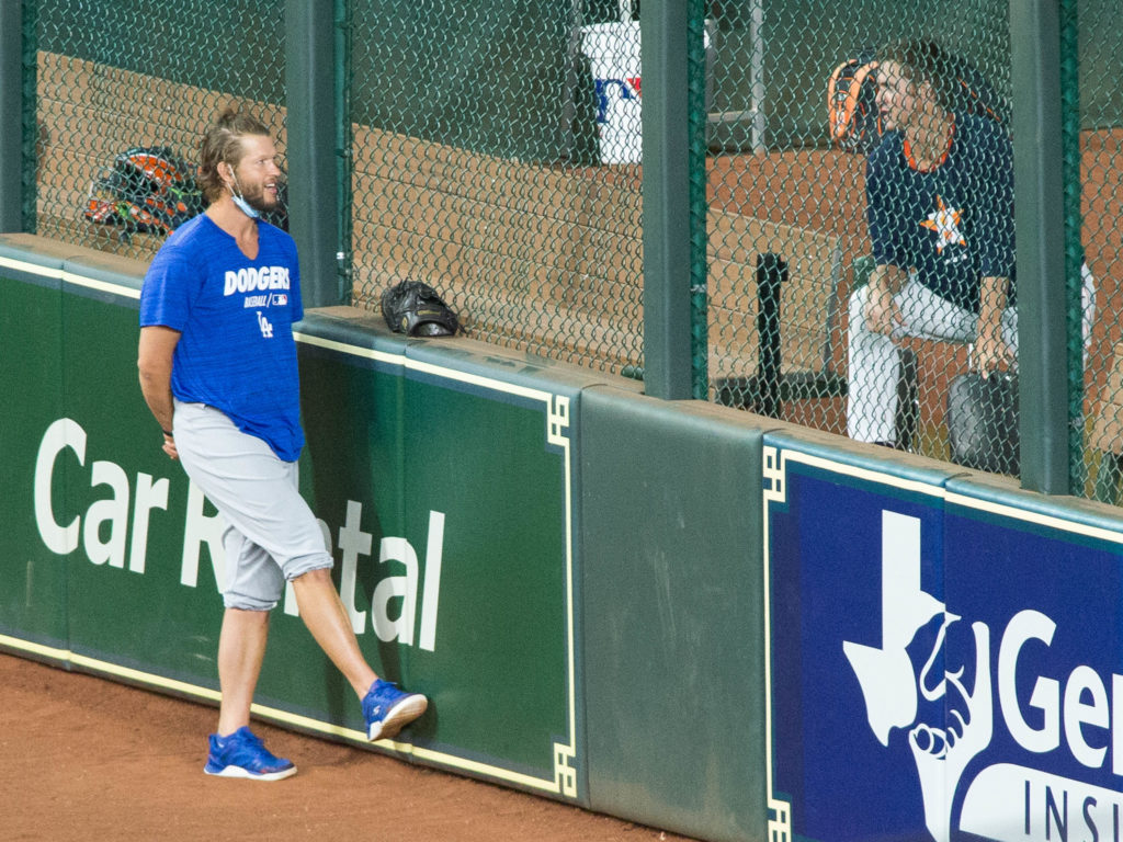 Los Angeles Dodgers Clayton Kershaw, currently on the injured list, chats with former teammate and current Astros pitcher Zack Greinke before a rematch of the 2017 World Series at Minute Maid Park. (Photo by F. Carter Smith)