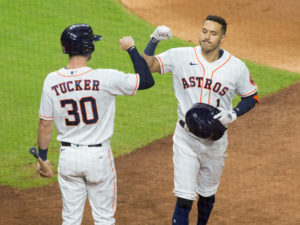 Carlos Correa celebrates his homerun with Kyle Tucker in the second inning against the Los Angeles Dodgers in a rematch of the 2017 World Series at Minute Maid Park