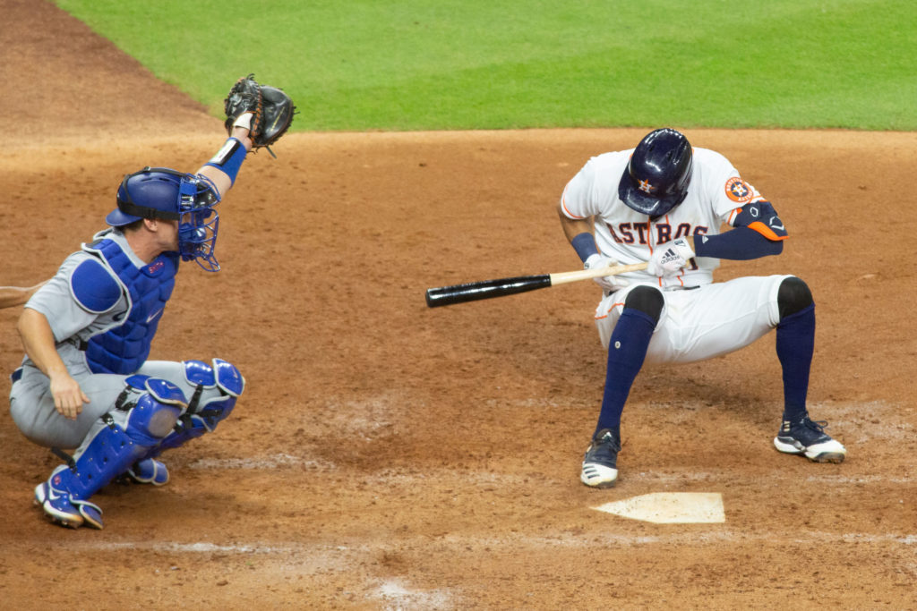Astros shortstop Carlos Correa is brought down by Los Angeles Dodgers reliever Joe Kelly in the 6th inning of a rematch of the 2017 World Series at Minute Maid Park. (Photo by F. Carter Smith)